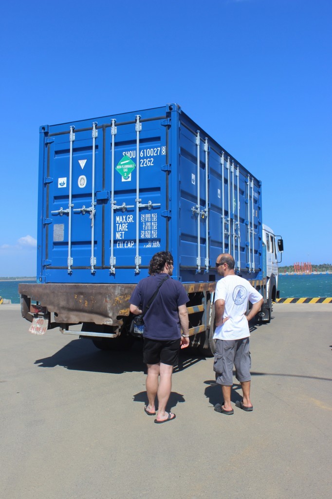 Orkan and Zafer discuss the best location for the container near the dock.  Photo by Arianna DiMucci.