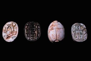 These three scarabs and the scarab-shaped plaque (inscribed on both faces) on the right from the wreck seem to have been manufactured on the Syro- Palestinian coast rather than in Egypt. (Photo: INA) Slide# CG406.
