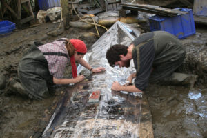 Rebecca Ingram (L) and Michael Jones (R) draw the in situ planking of YK 11 at 1:1 scale on clear plastic film. October 2008 (Photo: S. Matthews).  REF4812