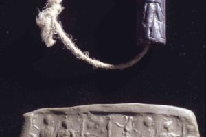Syrian cylinder seal with the long dead merchant’s “signature” and its clay impression. (Photo: INA, Slide # CG624).